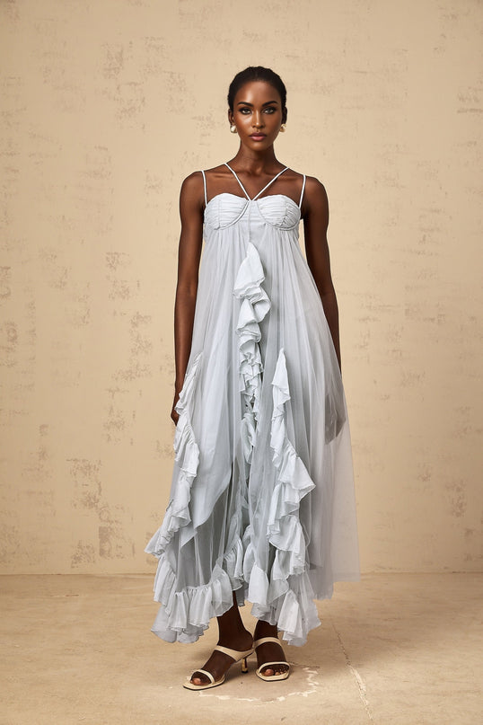 A long blue maxi dress with layered ruffles and a tulle skirt named Colette