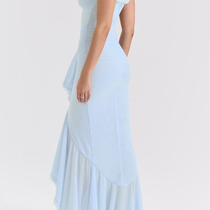 A long blue maxi dress with ruffle details and draped fabric featuring a flowing silhouette and feminine design