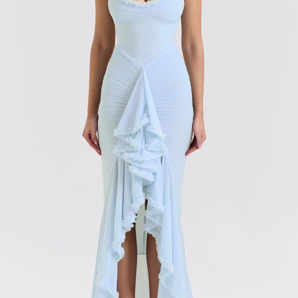 A long blue maxi dress with ruffle details and draped fabric featuring a flowy silhouette and feminine design
