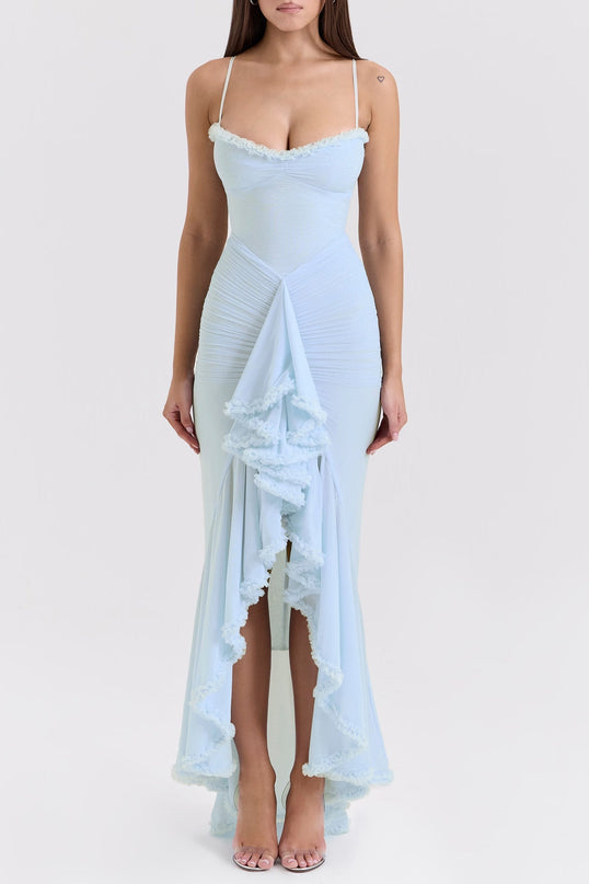 A long blue maxi dress with ruffle details and draped fabric featuring a flowy silhouette and feminine design