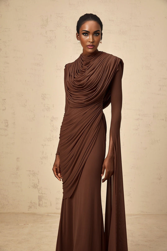 A long brown maxi dress with a draped design and shirred effect details