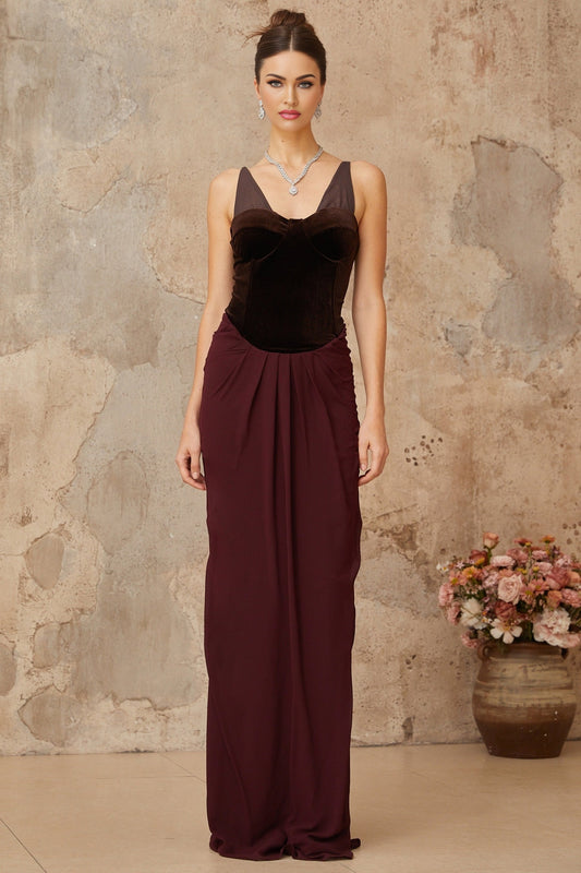 A long burgundy maxi dress with velvet panels and shirred detailing