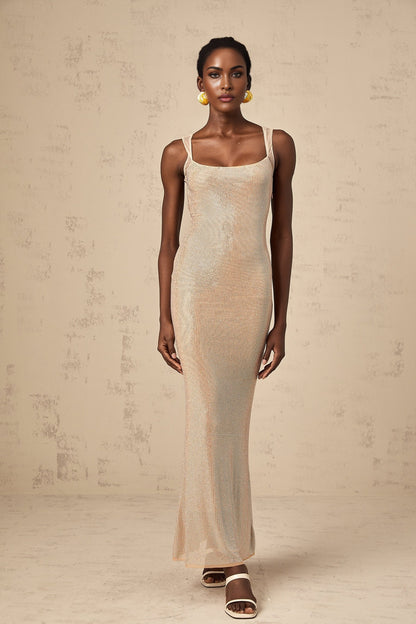 A long elegant maxi dress with crystal embellishments and an open back design