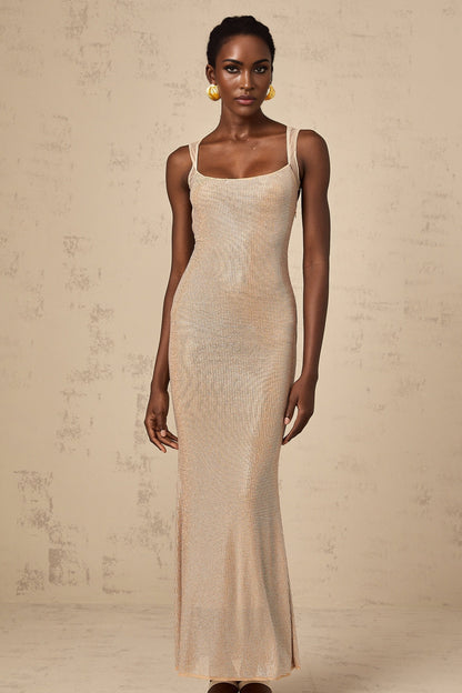 A long elegant maxi dress with crystal embellishments and an open back design
