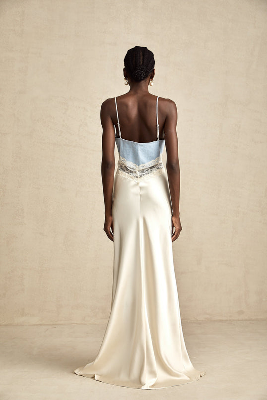 A long elegant maxi dress with lace trim and panel details in a flowing silhouette