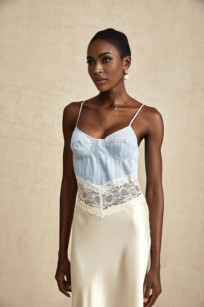 A long elegant maxi dress with lace trim and panels featuring a feminine silhouette in a flowing fabric