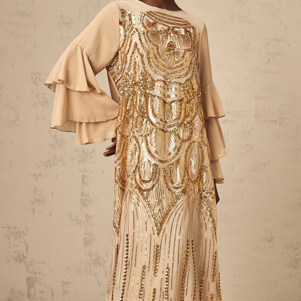 A long elegant maxi dress with ruffle sleeves and sequin embellishments on tulle fabric