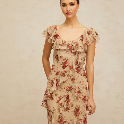 A long flared maxi dress with a floral print pattern and ruffled details shown on a model or hanging display