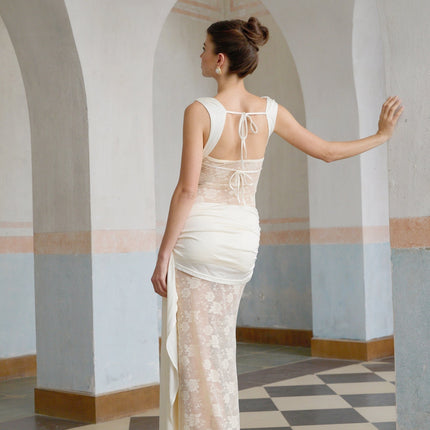 A long floral lace maxi dress in neutral tones featuring ribbon panelling and a delicate design