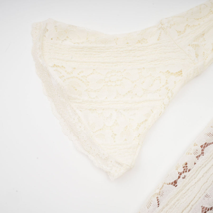 A long floral lace maxi dress in neutral tones with a train design named Emeline