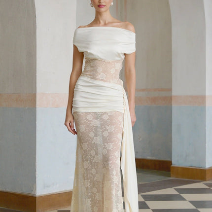 A long floral lace maxi dress in neutral tones with ribbon panelling details and a feminine silhouette