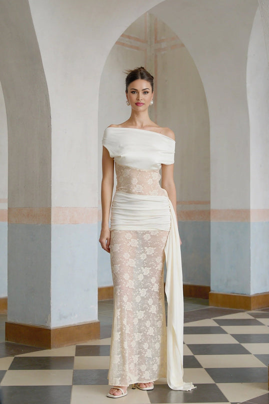 A long floral lace maxi dress in neutral tones with ribbon panelling details