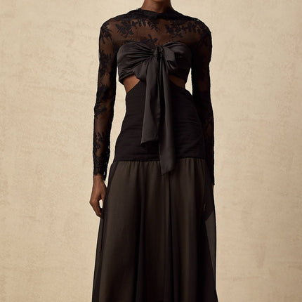 A long floral lace maxi dress with panels featuring a delicate pattern and flowing silhouette