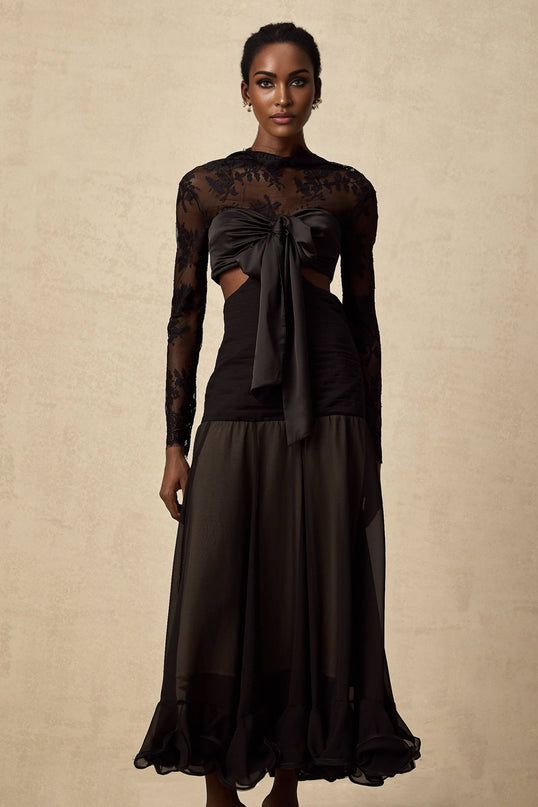 A long floral lace maxi dress with panels featuring a delicate pattern and flowing silhouette