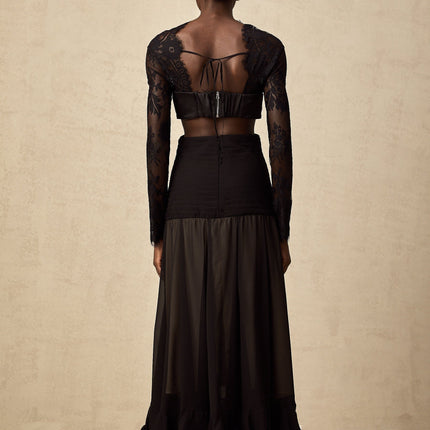 A long floral lace maxi dress with panels in a romantic style featuring delicate lace patterns and a flowing silhouette