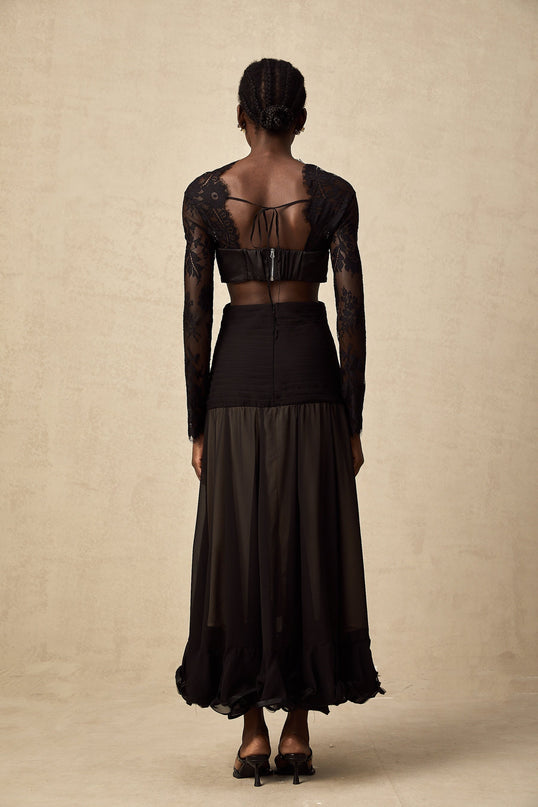 A long floral lace maxi dress with panels in a romantic style featuring delicate lace patterns and a flowing silhouette