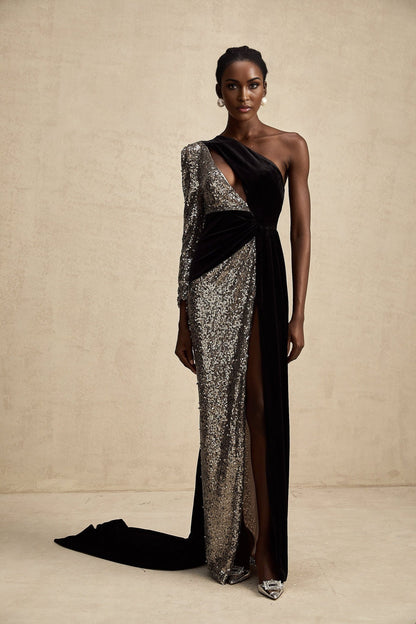 A long flowing asymmetric maxi dress covered in shimmering sequins with a distinctive silhouette named Juliette