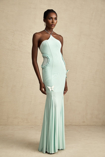 A long flowing maxi dress with butterfly pattern and ruffle details named Amelie