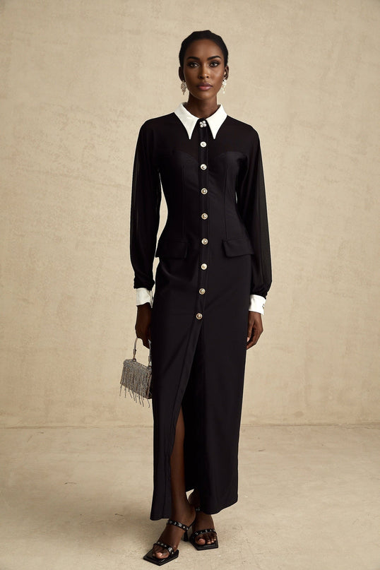 A long flowing maxi dress with contrasting colors and semisheer fabric featuring a light airy design and full length skirt