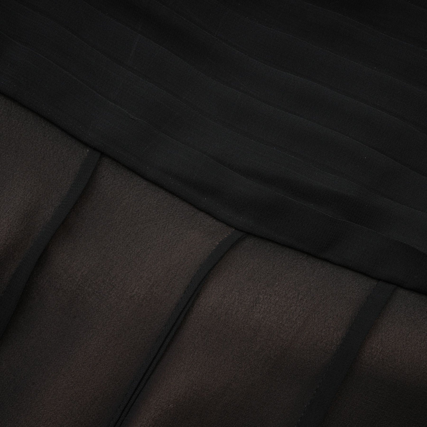 A long flowing maxi skirt with ruffles and pleats made from rayon and tulle fabric in a feminine Jacqueline style