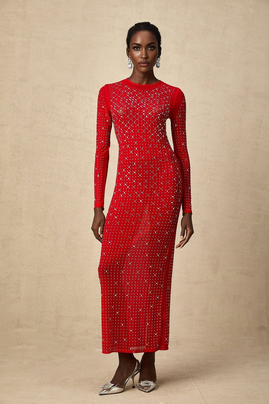 A long flowing red maxi dress with tulle fabric and rhinestone embellishments