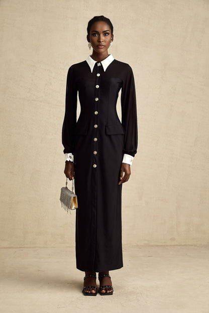 A long flowy maxi dress with contrasting colors and semisheer fabric featuring a lightweight and airy design