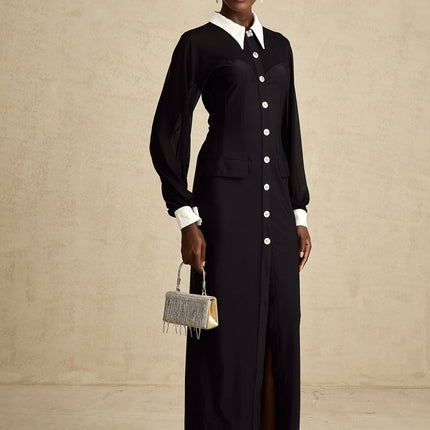 A long flowy maxi dress with contrasting colors and semisheer fabric