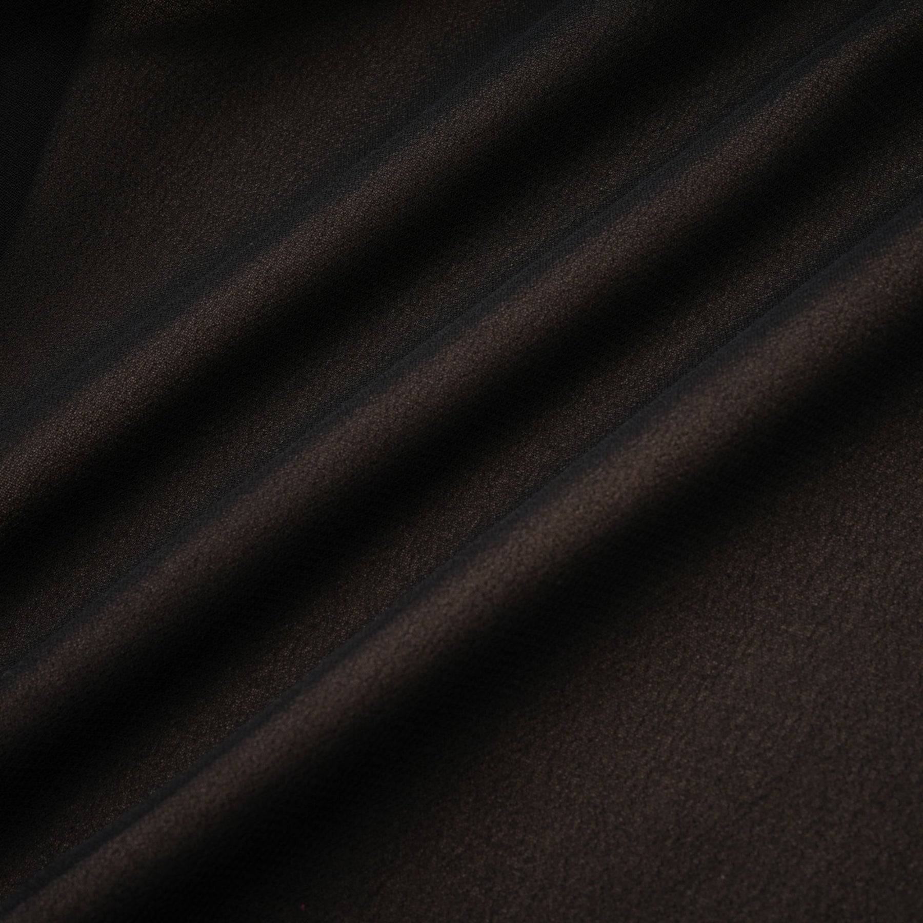 A long flowy maxi skirt with ruffles and pleats made of rayon and tulle fabric in a light color