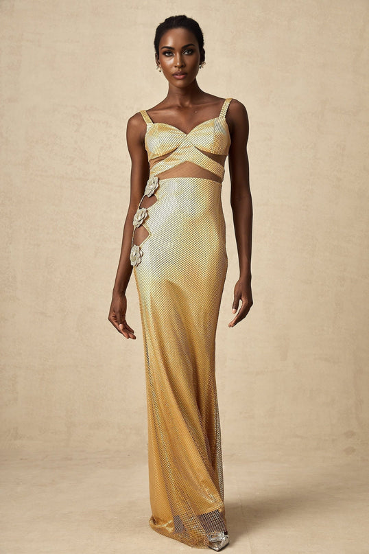 A long gold maxi dress with floral cutout patterns featuring a sleeveless design and flowing silhouette