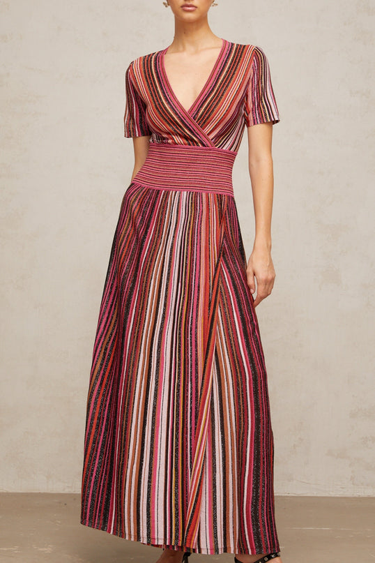 A long maxi dress with a multicolor metallic knit pattern featuring various bright hues in a shimmering fabric