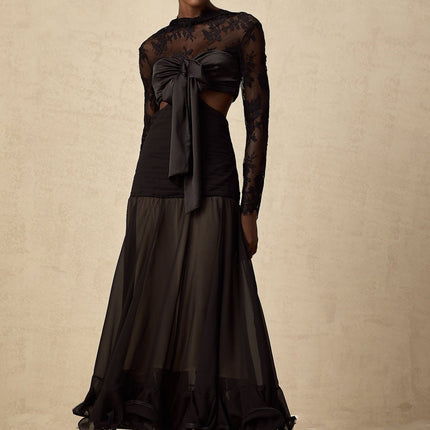 A long maxi dress with floral lace panels and a combination of solid and sheer fabric featuring a feminine silhouette and delicate floral patterns throughout