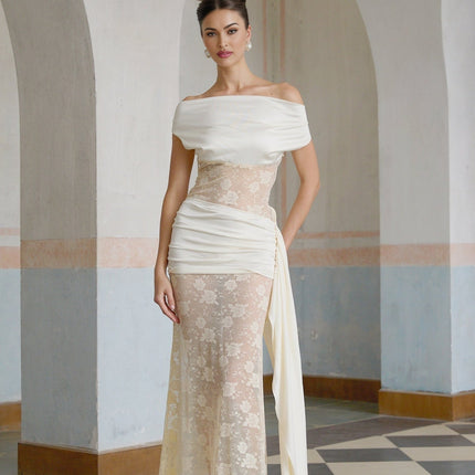 A long maxi dress with floral lace panels and ribbon details in neutral colors featuring a delicate and feminine design