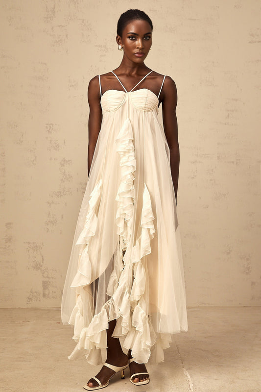 A long neutralcolored maxi dress with multiple layers of ruffled tulle fabric creating a flowing and romantic silhouette