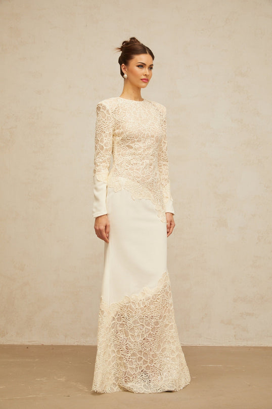 A long offwhite maxi dress with textured floral embroidery and sequin details named Mathilde
