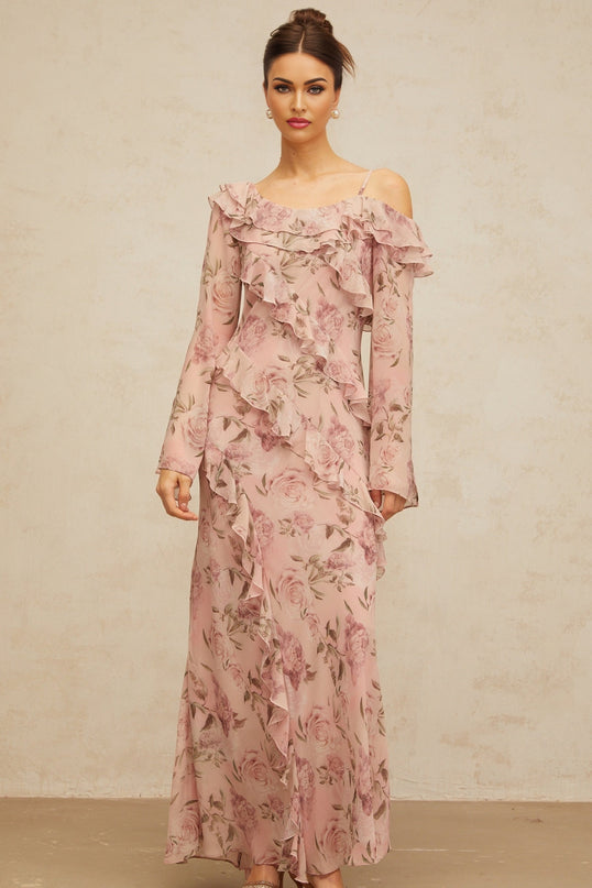 A long pink maxi dress with a floral print pattern and ruffled details named Clemence