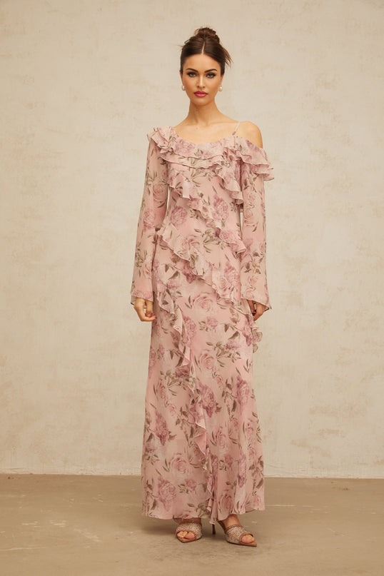 A long pink maxi dress with a floral print pattern and ruffled details named Clemence