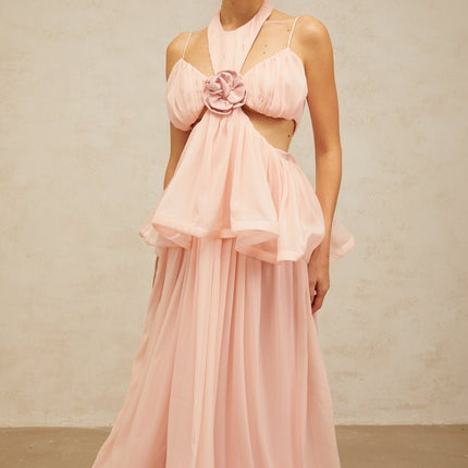 A long pink maxi dress with floral appliques and cutout details featuring a romantic and feminine design