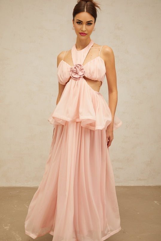 A long pink maxi dress with floral appliques and cutout details featuring a romantic and feminine design