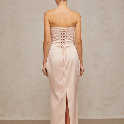 A long pink satin maxi dress with an offshoulder corset style bodice