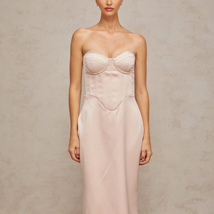 A long pink satin maxi dress with an offshoulder corset style bodice