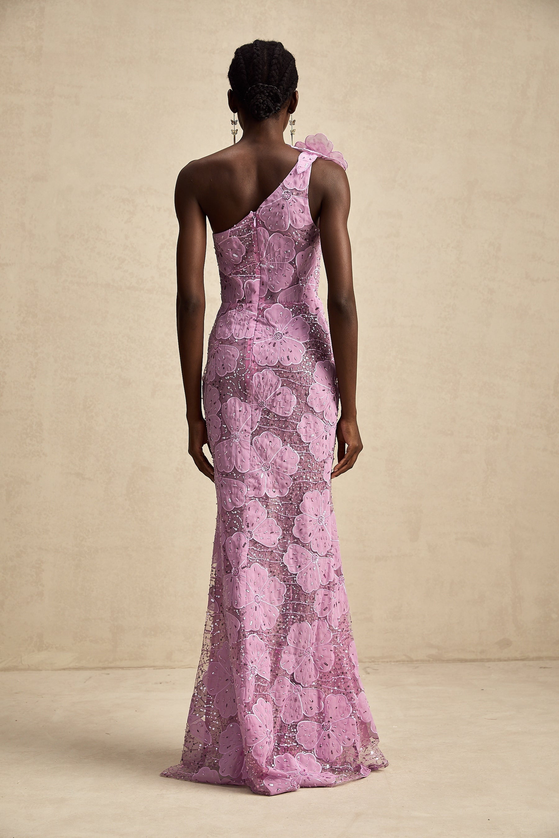 A long purple maxi dress with floral applique detailing named Beatrice