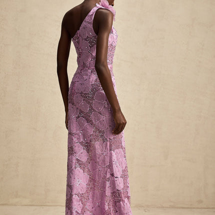 A long purple maxi dress with floral applique details