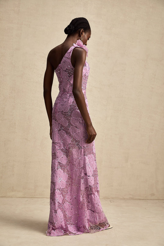 A long purple maxi dress with floral applique details