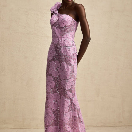 A long purple maxi dress with floral applique details