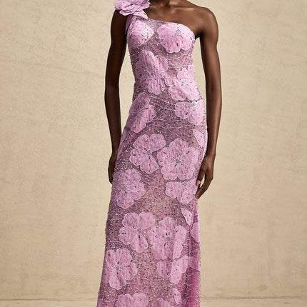 A long purple maxi dress with floral applique details