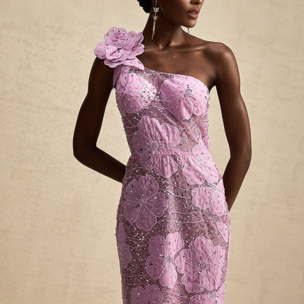 A long purple maxi dress with floral applique details