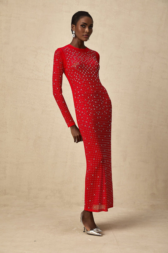 A long red maxi dress with tulle fabric and rhinestone embellishments