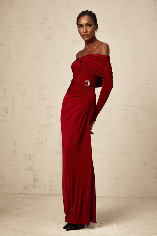 A long red velvet maxi dress with ruched detailing and a fitted silhouette named Helene