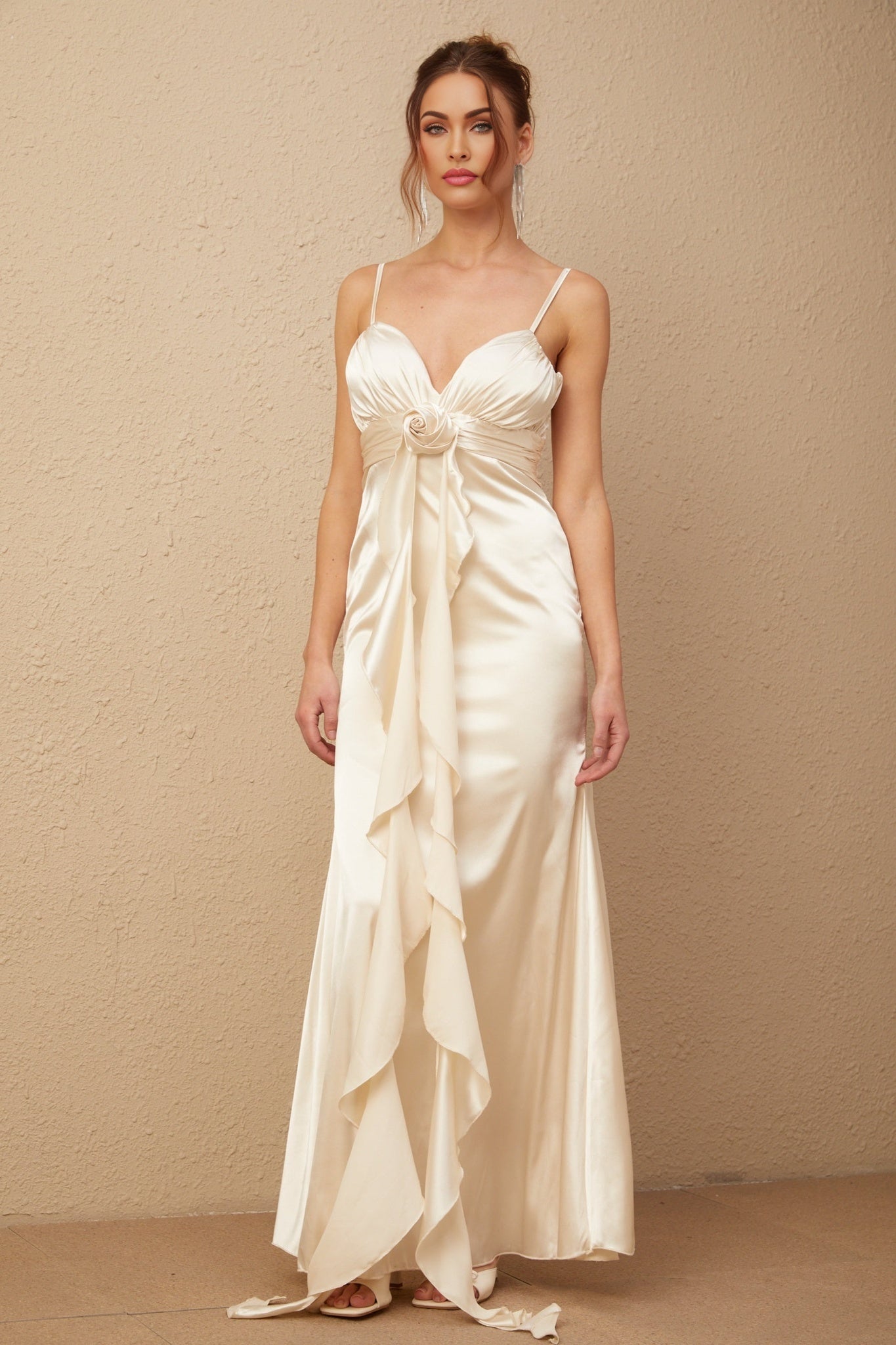 A long satin maxi dress with a corset bodice featuring floral applique details and a floral pattern throughout the fabric