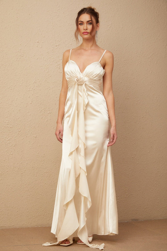 A long satin maxi dress with a corset bodice featuring floral applique details and a floral pattern throughout the fabric